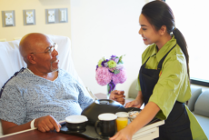 Caregiver serve a foods to an old Man