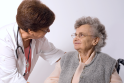 Speech therapist evaluates the communication of an elderly woman.